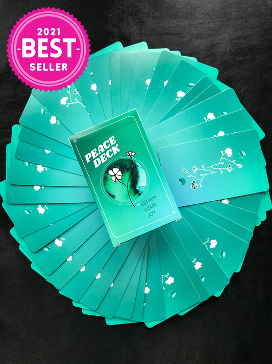 Peace Deck, Box + 44 cards fanned out, showing card backs. Hot pink seal that reads, "2021 BEST SELLER"