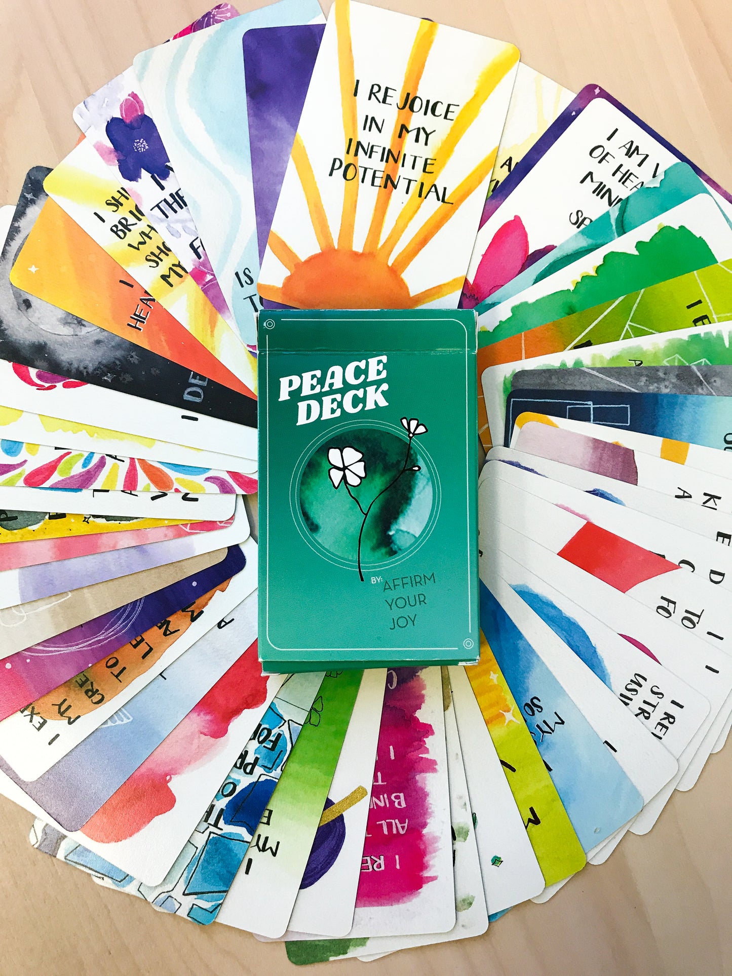 Peace Deck Affirmation Cards fanned out with designs facing up